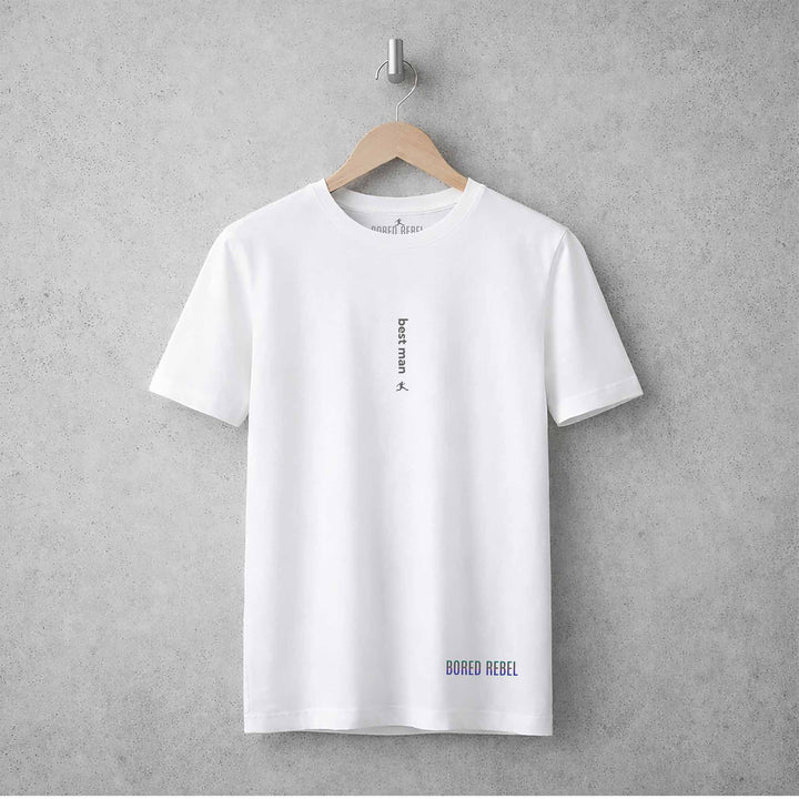 White crew neck Bored Rebel tee featuring the patented vertical saying Best Man hanging on concrete wall.